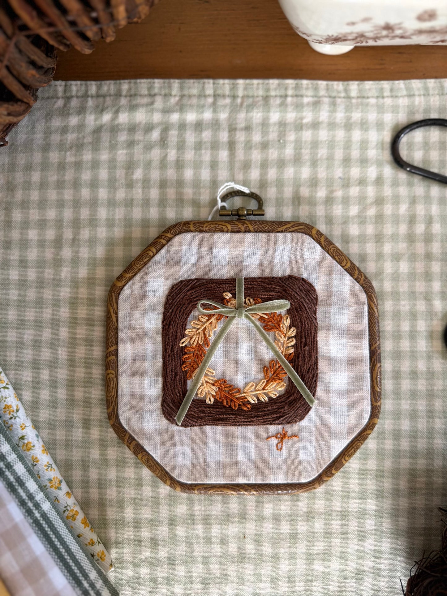 Large Brown Wicker Frame with Fall Wreath on Gingham Fabric