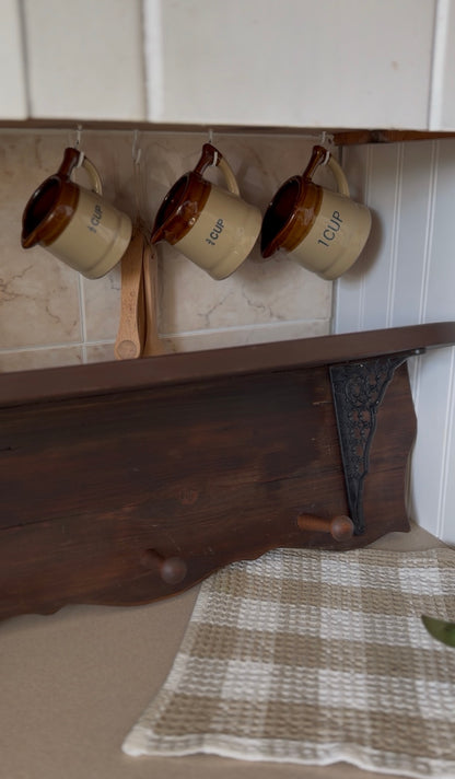 Wooden Shelf with Wrought Iron Corbels and Pegs