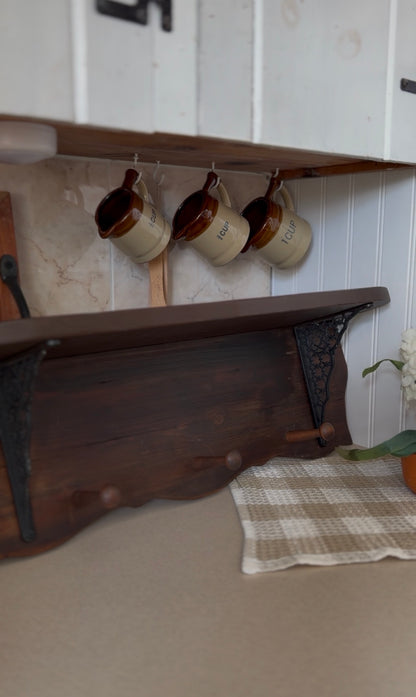 Wooden Shelf with Wrought Iron Corbels and Pegs