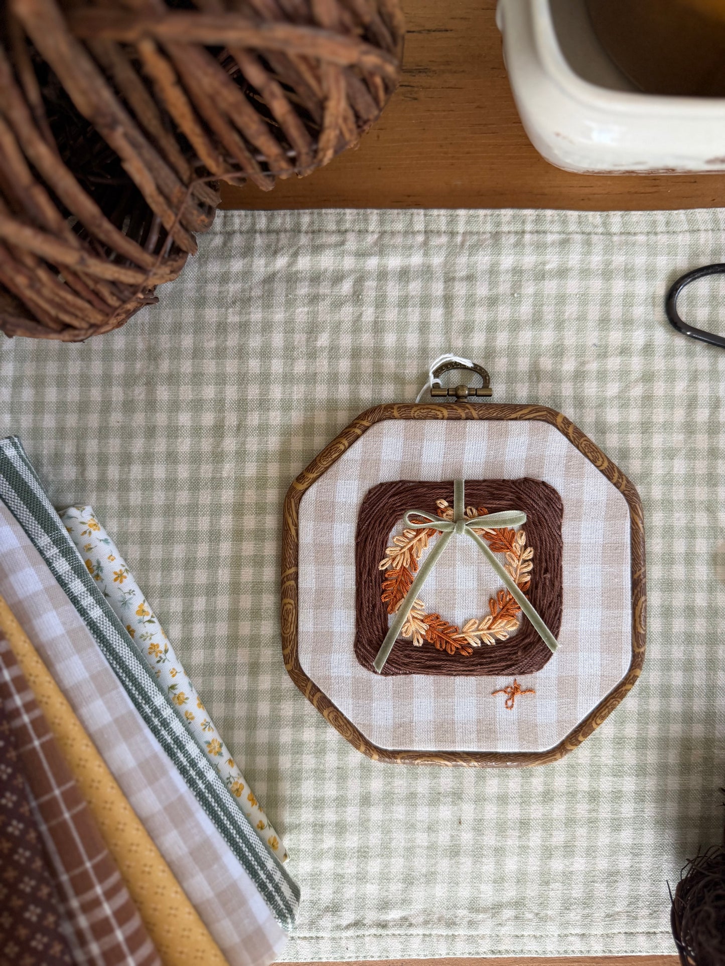 Large Brown Wicker Frame with Fall Wreath on Gingham Fabric