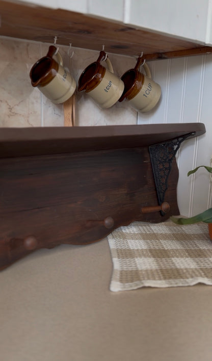 Wooden Shelf with Wrought Iron Corbels and Pegs