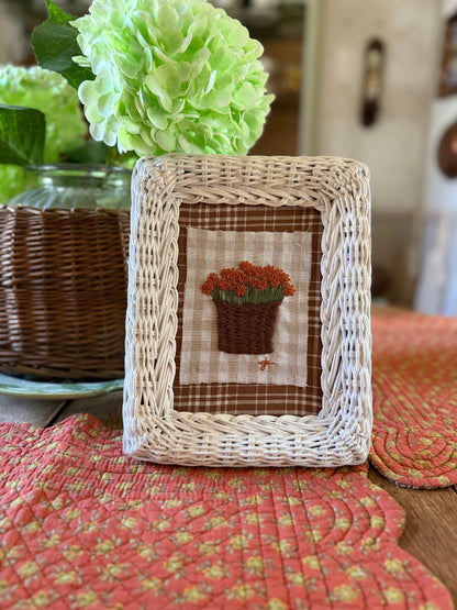 Burnt Orange Mum in Basket Embroidery Art in a White Wicker Frame